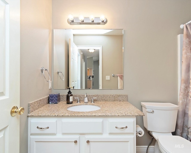 bathroom with vanity and toilet