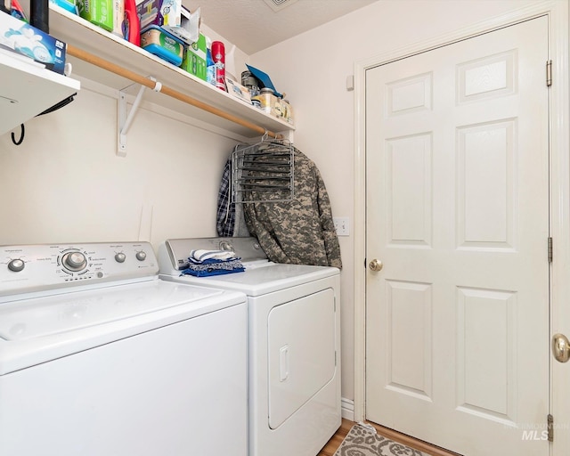 laundry area featuring washer and dryer and laundry area