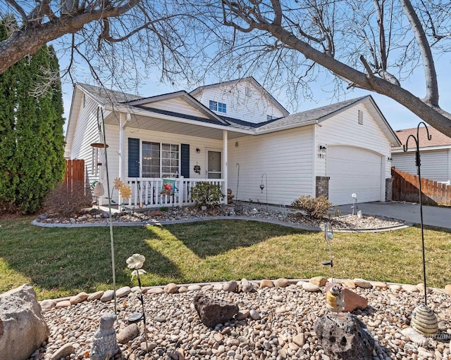 view of front of property with fence, a porch, a front yard, a garage, and driveway