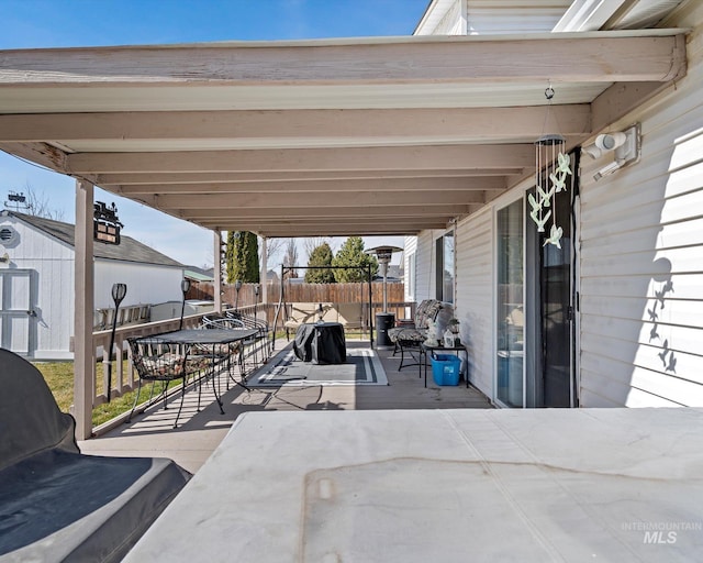 view of patio / terrace featuring fence