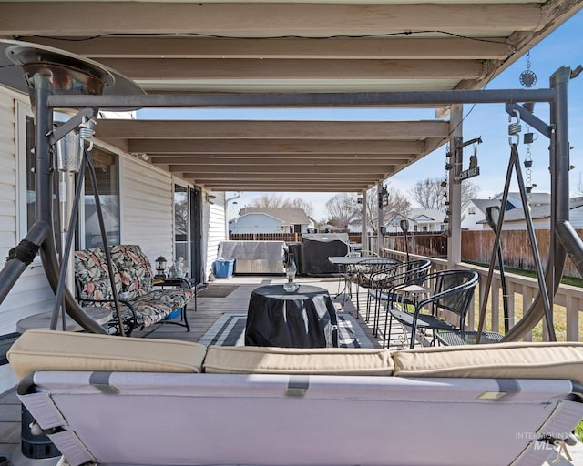 view of patio / terrace featuring outdoor lounge area and fence