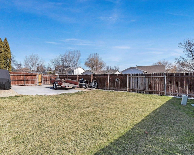 view of yard featuring a patio area and a fenced backyard