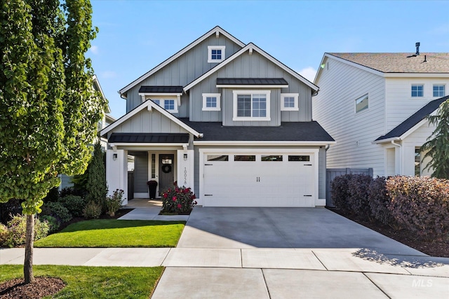 craftsman-style home featuring a garage and a front yard