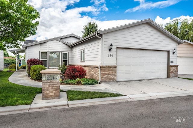 421 Curtis Rd Unit 120, Boise, ID 83705 - single story home featuring an attached garage, brick siding, and concrete driveway