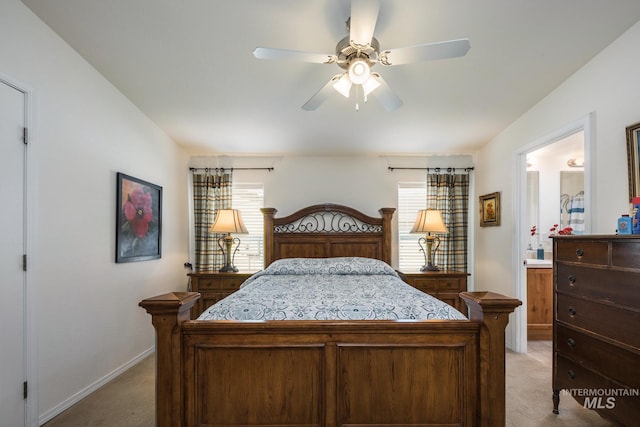 421 Curtis Rd Unit 120, Boise, ID 83705 - bedroom with light colored carpet, baseboards, ensuite bath, and ceiling fan