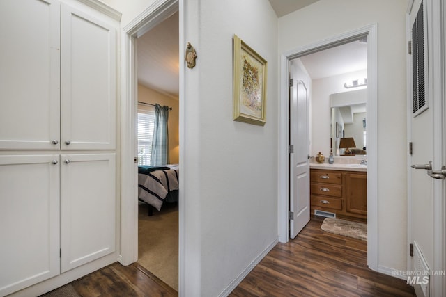 421 Curtis Rd Unit 120, Boise, ID 83705 - hallway featuring dark wood-style floors, baseboards, and a sink