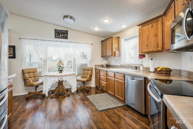 421 Curtis Rd Unit 120, Boise, ID 83705 - kitchen featuring stainless steel appliances, brown cabinets, light countertops, a sink, and recessed lighting