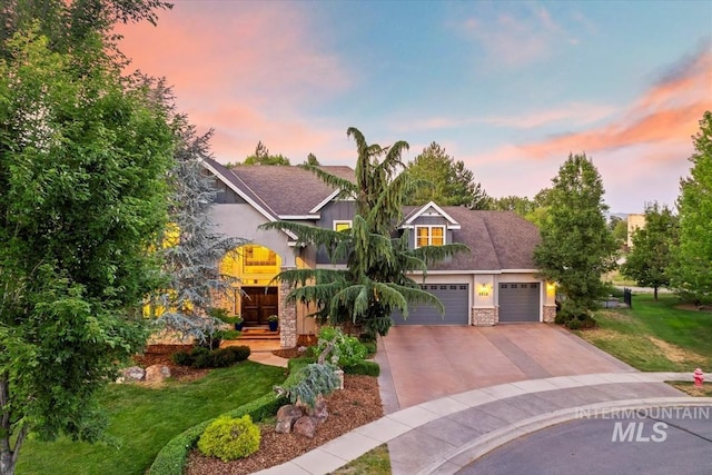 1512 E Rivers End Ct, Eagle, ID 83616 - view of front facade featuring stone siding, driveway, a front lawn, and stucco siding
