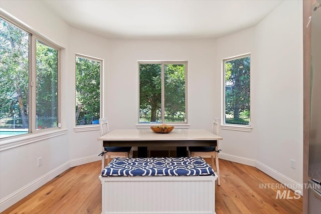 1512 E Rivers End Ct, Eagle, ID 83616 - dining room featuring light wood-style floors and healthy amount of natural light