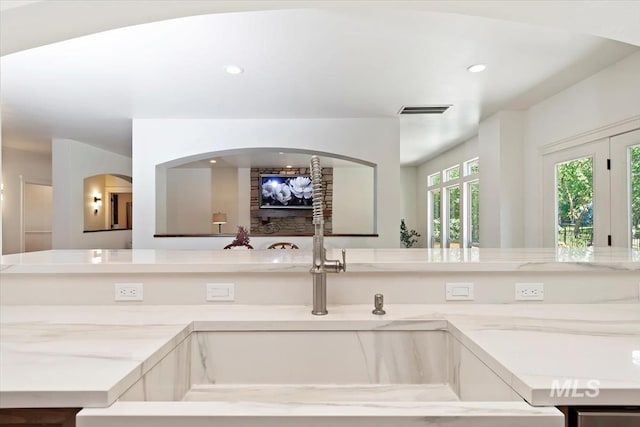 1512 E Rivers End Ct, Eagle, ID 83616 - kitchen featuring light stone counters and recessed lighting