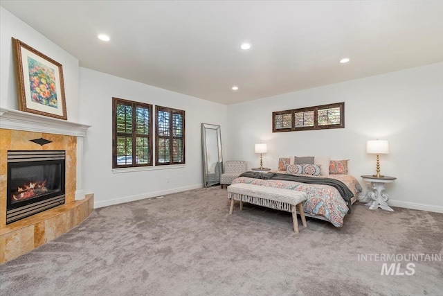 1512 E Rivers End Ct, Eagle, ID 83616 - bedroom with carpet flooring, a high end fireplace, and recessed lighting