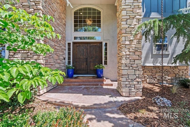 1512 E Rivers End Ct, Eagle, ID 83616 - entrance to property featuring stone siding and stucco siding