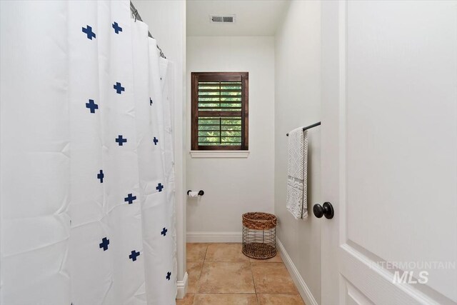 1512 E Rivers End Ct, Eagle, ID 83616 - bathroom featuring tile patterned flooring and baseboards