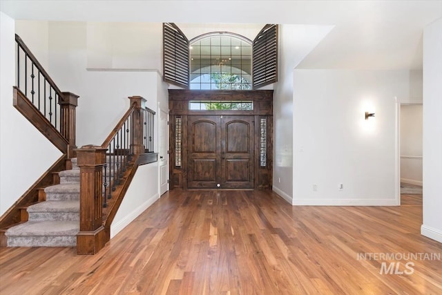 1512 E Rivers End Ct, Eagle, ID 83616 - foyer entrance featuring stairway and wood finished floors