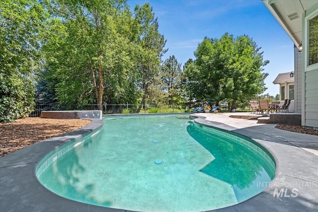 1512 E Rivers End Ct, Eagle, ID 83616 - view of pool with a patio area and a fenced backyard