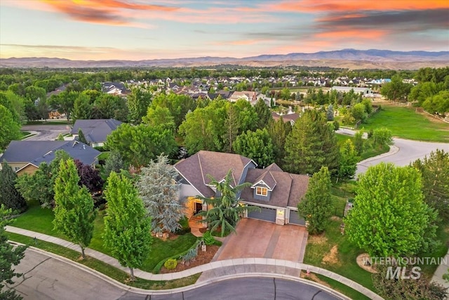 1512 E Rivers End Ct, Eagle, ID 83616 - aerial view at dusk of a mountain view and a residential view