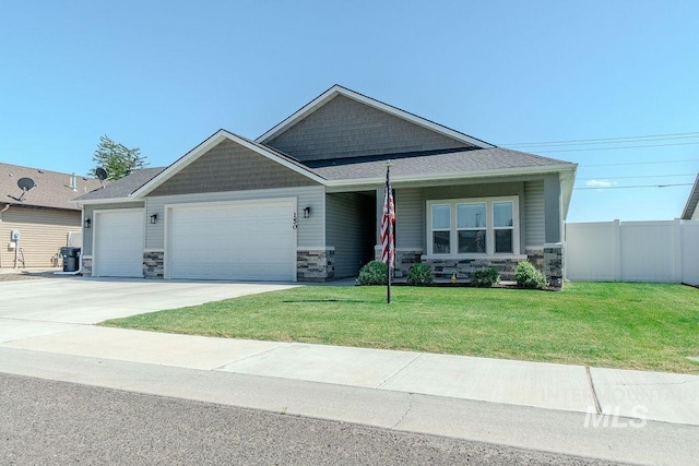 150 Cayuse Creek Dr, Kimberly, ID 83341 - craftsman inspired home featuring stone siding, an attached garage, and driveway