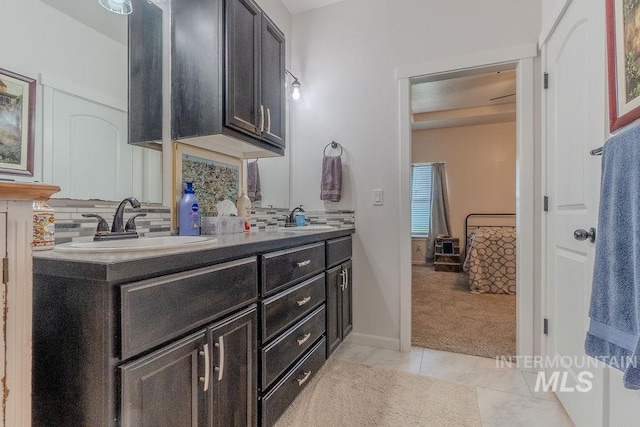 150 Cayuse Creek Dr, Kimberly, ID 83341 - full bathroom with double vanity, tasteful backsplash, and tile patterned floors