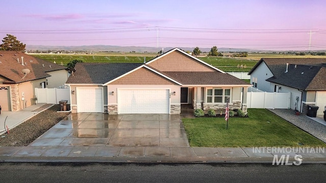 150 Cayuse Creek Dr, Kimberly, ID 83341 - view of front of property with stone siding, an attached garage, and concrete driveway