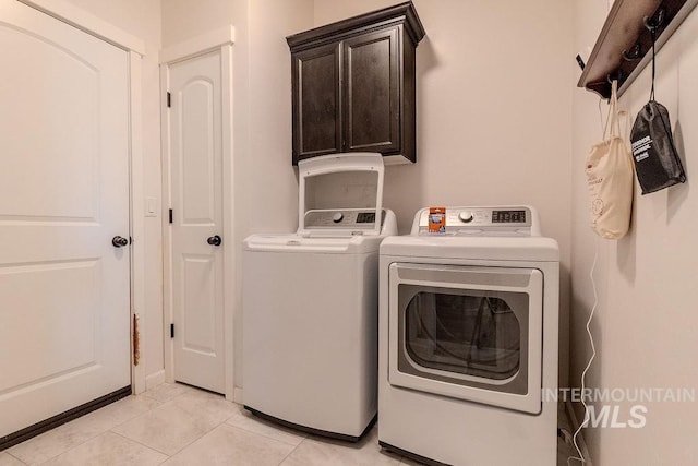 150 Cayuse Creek Dr, Kimberly, ID 83341 - washroom with independent washer and dryer, cabinet space, and light tile patterned floors