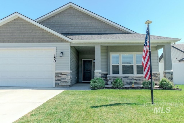 150 Cayuse Creek Dr, Kimberly, ID 83341 - craftsman house with stone siding, a front yard, an attached garage, roof with shingles, and driveway