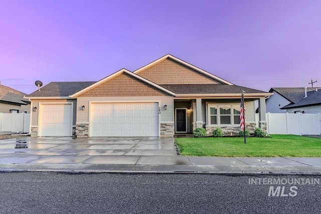 150 Cayuse Creek Dr, Kimberly, ID 83341 - craftsman-style home featuring a garage, stone siding, and concrete driveway