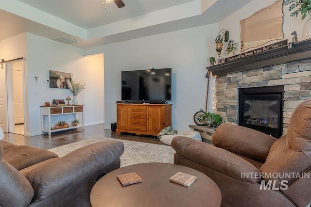 150 Cayuse Creek Dr, Kimberly, ID 83341 - living room with wood finished floors, a barn door, and a ceiling fan