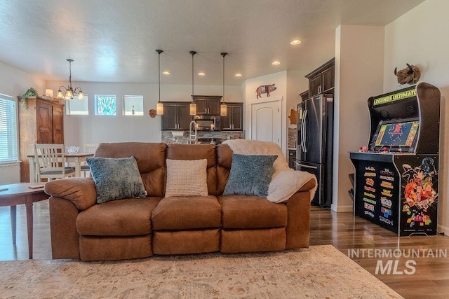 150 Cayuse Creek Dr, Kimberly, ID 83341 - living area featuring a chandelier, wood finished floors, and recessed lighting