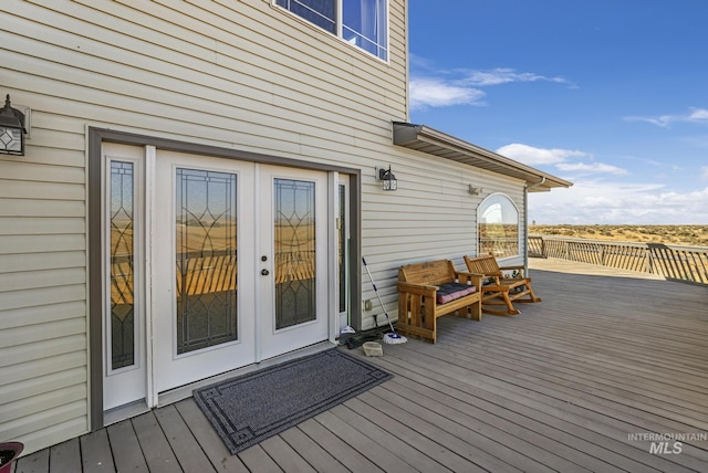 wooden deck featuring french doors
