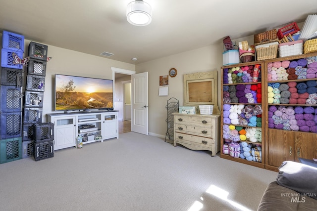rec room featuring light colored carpet