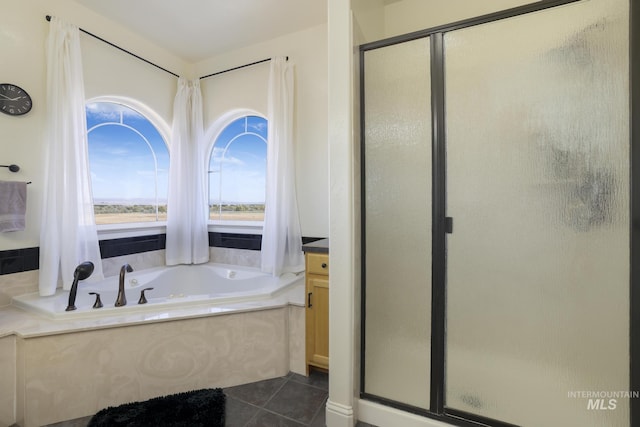 bathroom featuring tile patterned flooring, vanity, and separate shower and tub