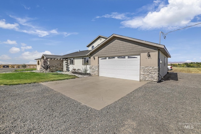 ranch-style house with a garage and a front lawn