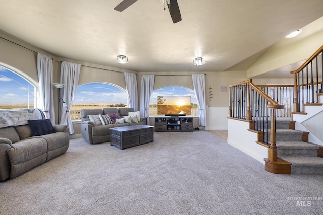 living room featuring a healthy amount of sunlight, carpet floors, and ceiling fan
