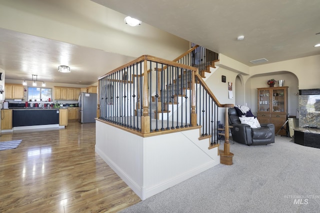 stairs with wood-type flooring