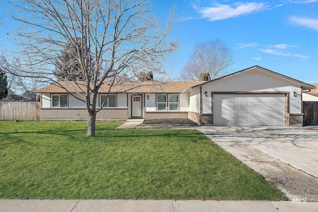 ranch-style house featuring a garage and a front lawn