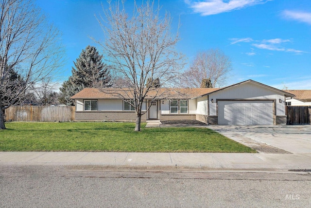 ranch-style house featuring a garage and a front lawn