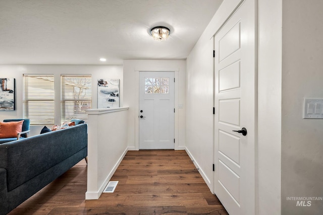 entryway with dark hardwood / wood-style floors