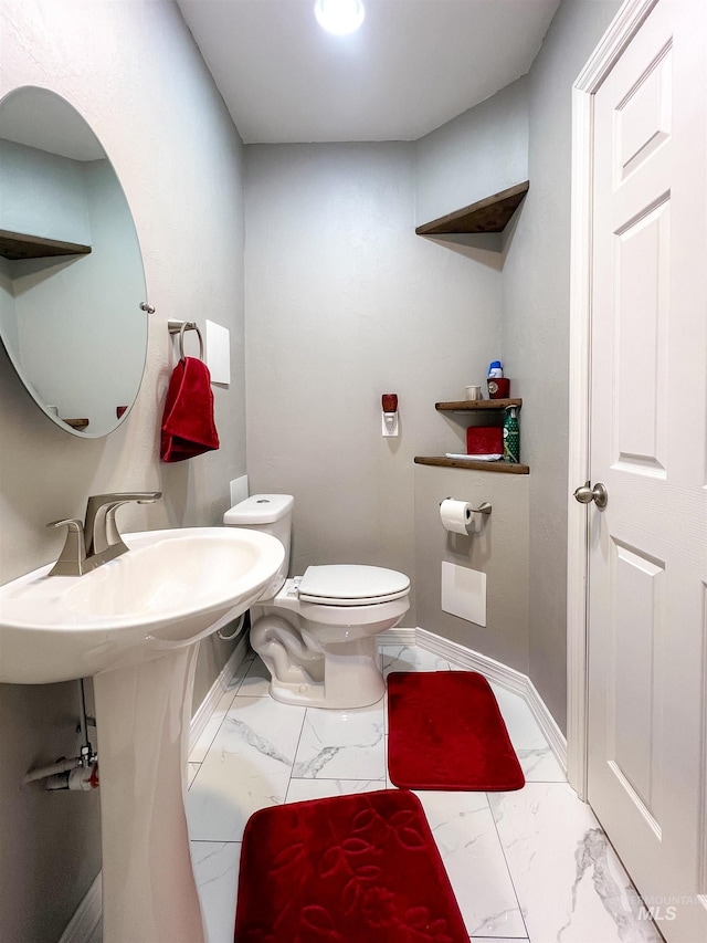 bathroom featuring toilet