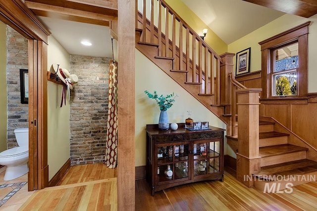 stairway with wood finished floors