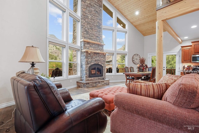 9 Autumn Blaze Ln, Salmon, ID 83467 - living area with high vaulted ceiling, baseboards, healthy amount of natural light, a stone fireplace, and recessed lighting