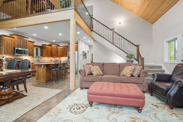 9 Autumn Blaze Ln, Salmon, ID 83467 - living room featuring high vaulted ceiling, light wood finished floors, recessed lighting, and stairs