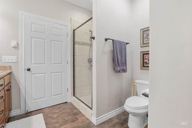 9 Autumn Blaze Ln, Salmon, ID 83467 - full bathroom with vanity, wood tiled floors, a shower stall, and toilet