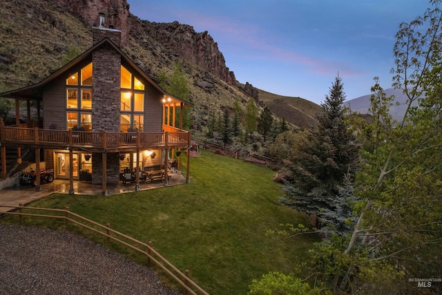9 Autumn Blaze Ln, Salmon, ID 83467 - view of grassy yard featuring a patio area and a deck with mountain view