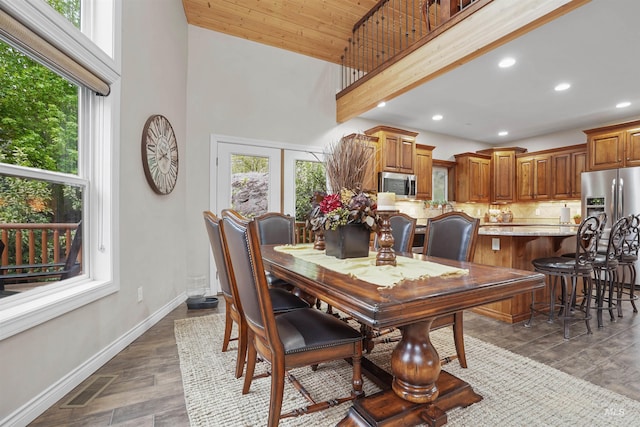 9 Autumn Blaze Ln, Salmon, ID 83467 - dining space featuring a high ceiling, baseboards, recessed lighting, and dark wood-style flooring
