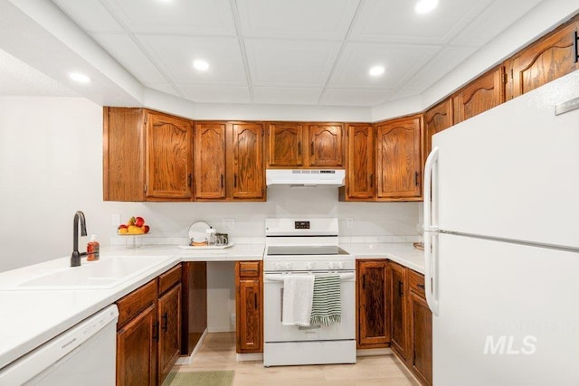122 N Washington, Moscow, ID 83843 - kitchen featuring white appliances, a sink, recessed lighting, and under cabinet range hood
