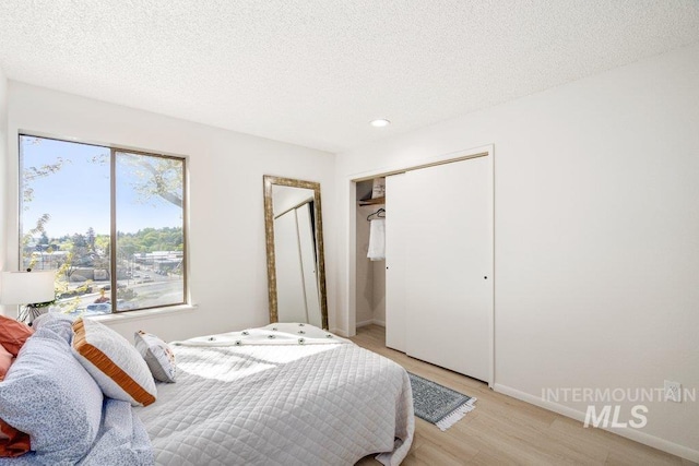 122 N Washington, Moscow, ID 83843 - bedroom with baseboards, multiple windows, recessed lighting, and light wood-type flooring