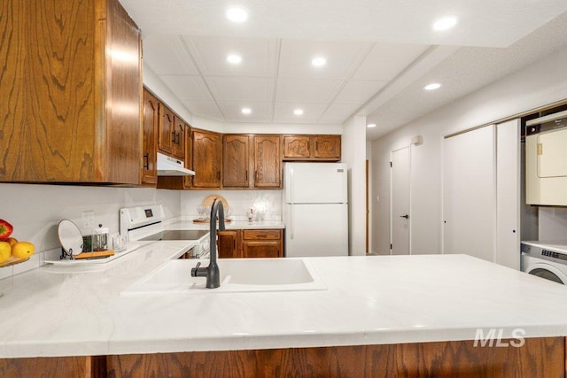 122 N Washington, Moscow, ID 83843 - kitchen featuring freestanding refrigerator, electric range oven, under cabinet range hood, light countertops, and recessed lighting