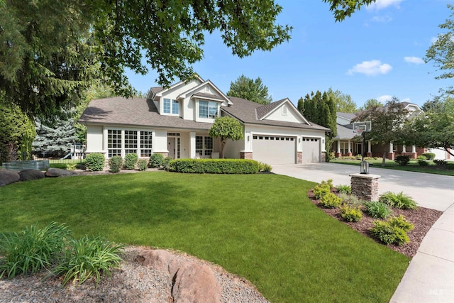 view of front facade with a garage, a front lawn, concrete driveway, and stucco siding