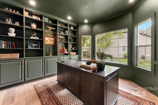 office area with a textured ceiling, ornamental molding, healthy amount of natural light, light wood-style floors, and recessed lighting