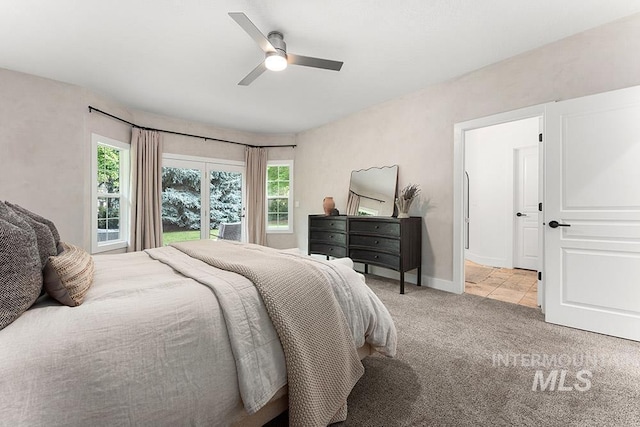 bedroom featuring carpet, a ceiling fan, and baseboards